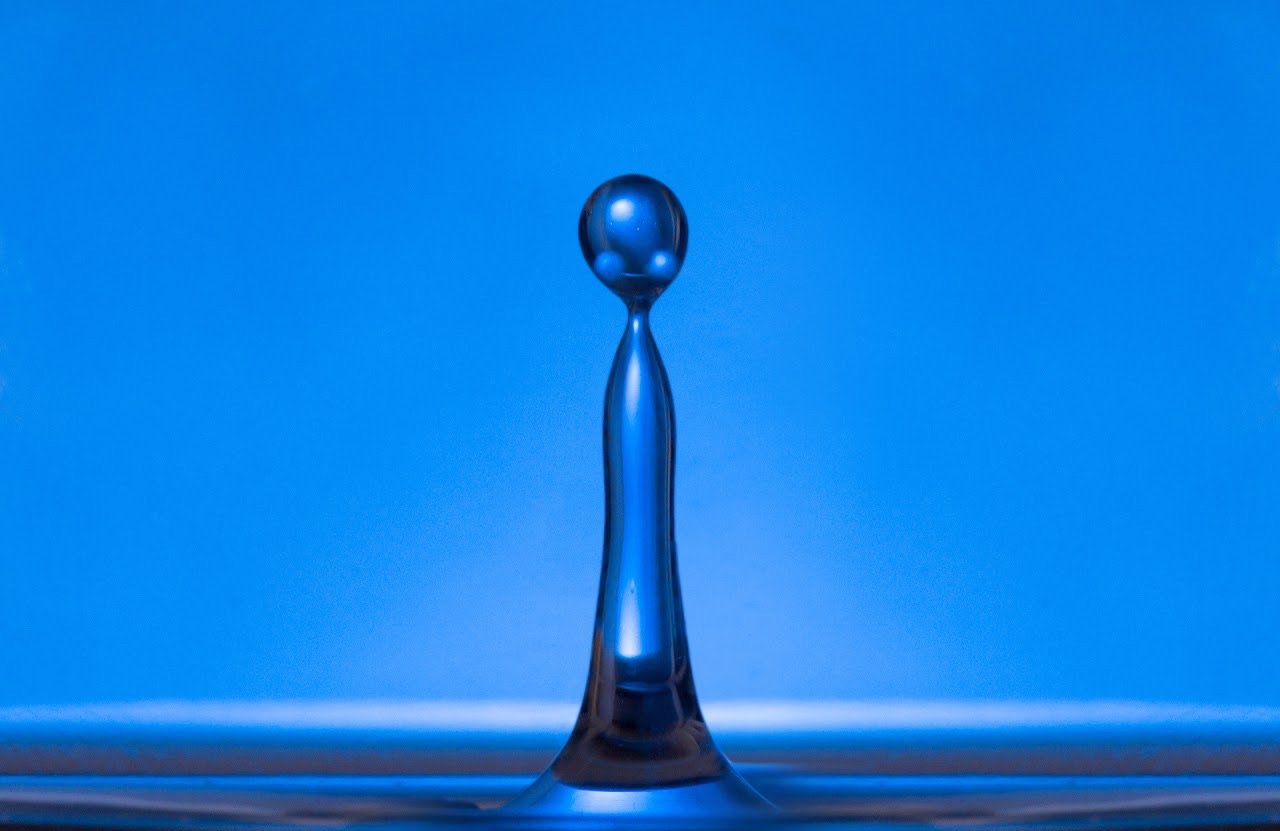 Blue water column and droplet.