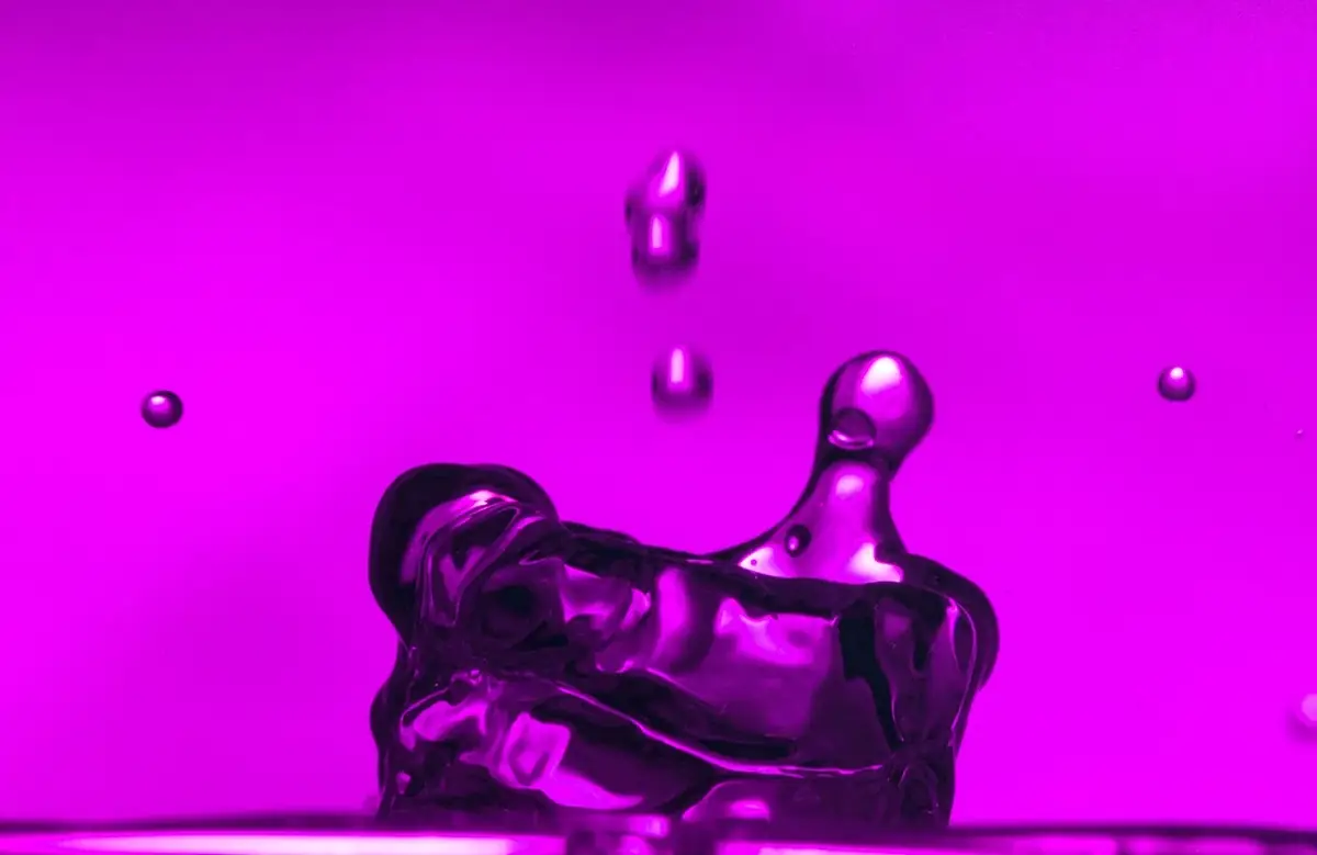 Magenta liquid collision.