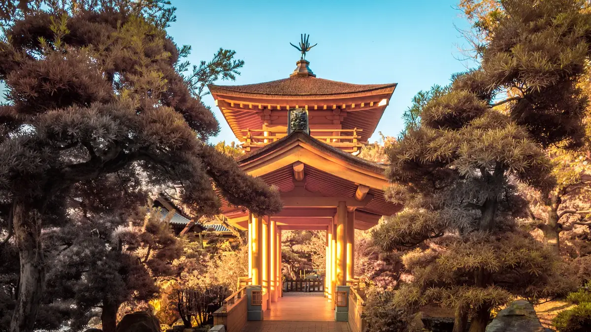 Infrared photograph of a pavilion framed by trees.