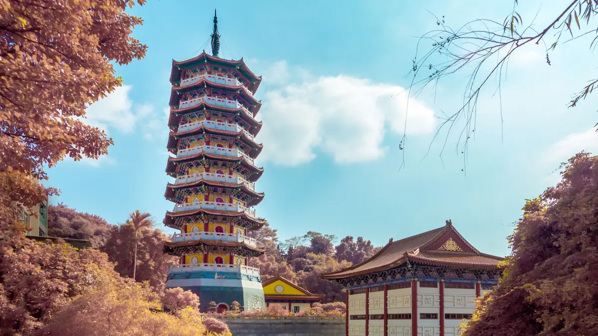 Infrared photograph of a pagoda under blue sky.